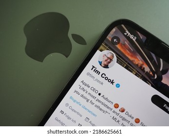 Munich, Germany - May 4th 2022: Tim Cook`s Twitter Account Displayed On An IPhone 13 With A Macbook Pro In The Background. 