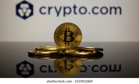 Munich, Germany; May 7, 2022: Bitcoin (BTC) With The Logo From Crypto Exchange Crypto.com In The Background