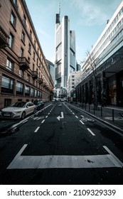 MUNICH, GERMANY - Nov 27, 2021: An empty street in Frankfurt financial district with skyscraper in background