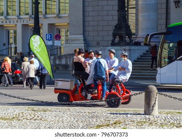 Munich, Germany - October 14, 2017: A Group Of Tourists Rides On A Special Electric Car For Drinking Beer