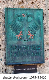 Munich, Germany - October 20, 2017:  Wall signboard of the German patent office with the coat of arms
