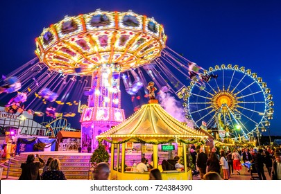 MUNICH, GERMANY - SEPTEMBER 21: people and fairground rides at the biggest folk festival in the world - the octoberfest on september 21, 2017 in munich. 