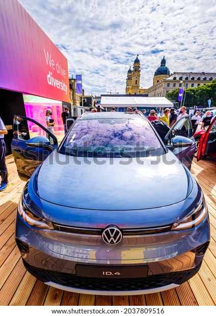 Munich, Germany - September 7: Audience at a car\
manufacturer\'s booth at the IAA (Internationale Auto Ausstellung -\
translation: international auto exhibition) trade fair in Munich on\
September 7,2021