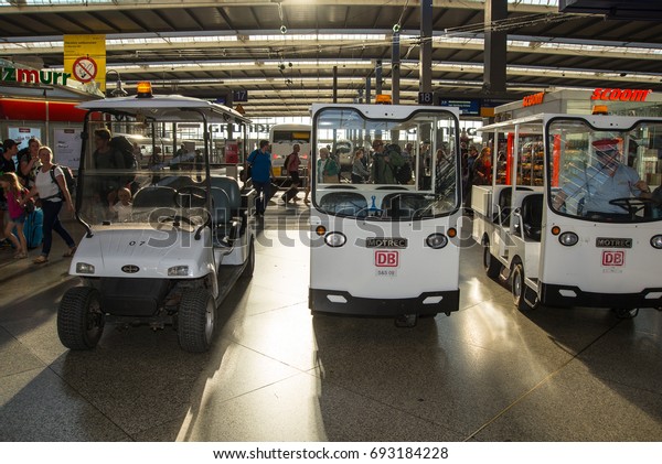 Munich,Germany-August 07,2017: Electric carts for\
transportation of passengers with disablities stand ready at Munich\
Central\
Station
