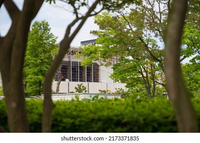 Municipal Gymnasium Seen From A Suburban Park