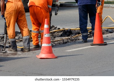 Municipal Service Repairs The Road.