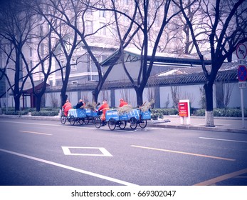 Municipal Street Cleaner On Bike, Beijing, China.
Picture Taken In March 2013