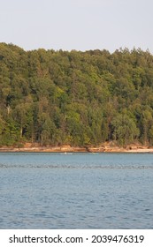 Munising, MI - August 18 2021: Kayaking Along Pictured Rocks National Lakeshore On Calm Waters