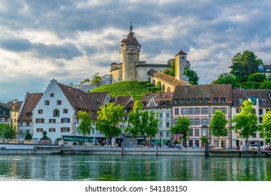 The munot fortress in the swiss city schaffhausen is reflected on the rhine river during sunset in summer.