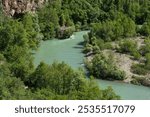 Munzur stream. Munzur river rafting trails. Munzur Stream nature park. Green Munzur valley.