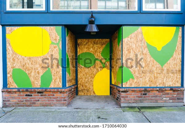 A mural on a boarded up storefront during the
coronavirus pandemic