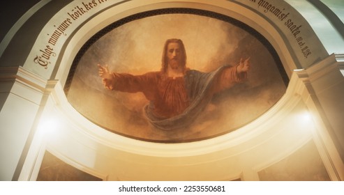 Mural Portrait of Lord Jesus Christ with Open Arms. A Painting on a Church Ceiling Depicting the Savior's Kindness and Acceptance of Devoted Believers. The Devine Light Shining Upon his Face - Shutterstock ID 2253550681