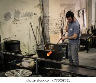  Murano Island, Italy - April 23, 2017: Glassblowing Artisan At Work In A Crystal Glass Workshop In Murano Island, Venice.