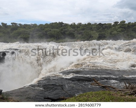 Murchison Falls Waterfall Cascading Through Rocky Gorge in Uganda