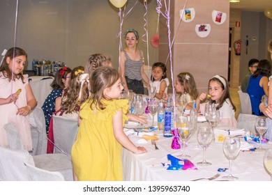 Murcia, Spain, May 12, 2019: Birthday Party With Friends. Little Girls Celebrating A Special Date. Familiar Gathering. Child, Children Or Kid, Kids Table In Restaurant,Communion, Weeding Or Birthday.