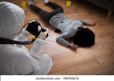 Murder, Investigation And Forensic Examination Concept - Criminalist With Camera Photographing Dead Female Victim Body At Crime Scene (staged Photo)