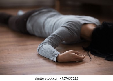 Murder, Kill And People Concept - Unconscious Or Dead Woman Body Lying On Floor At Crime Scene