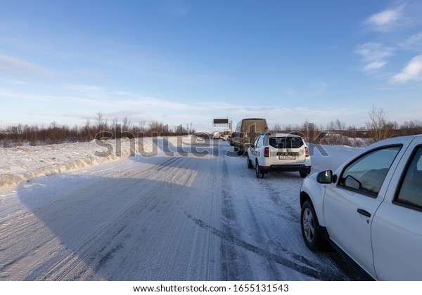 Murmansk, Murmansk region / Russia - 02.18/2020:
Closed road from Murmansk to Teriberka. Cars waiting to open on the
road, Russia