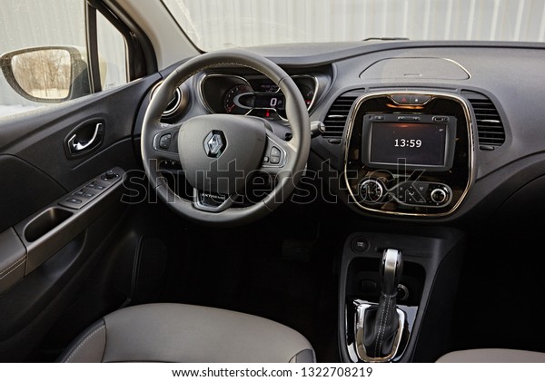 Murmansk Region, Russia - March 2018:  Dark car interior\
- steering wheel, shift lever and dashboard. Car modern SUV inside.\

