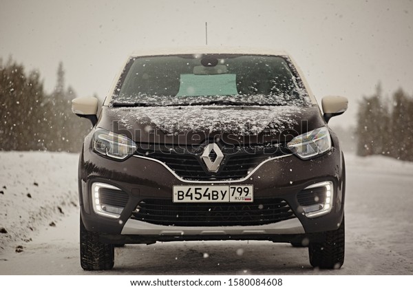 Murmansk Region, Russia -\
March 2018: Renault Captur class suv on a snowy road in the winter\
in the snowfall. Northern driving conditions are very dangerous.\
Front view