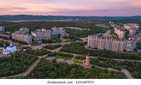 Murmansk, Russia - July 16, 2022: Aerial view panorama of city memorial Lighthouse northern city sunset.