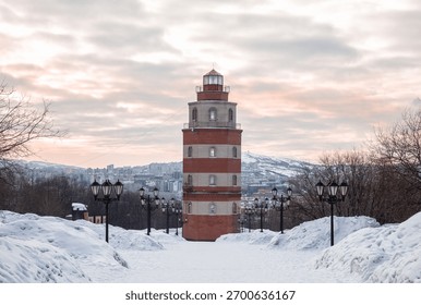 Murmansk in winter. The lighthouse tower is part of the memorial complex in memory of sailors who died in peacetime