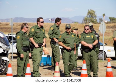 Murrieta, CA / USA - July 7 2014: Protesters And Counter-protesters Gather Near A US Customs And Border Protection Facility Used To House Undocumented Immigrants During A Surge In Border Crossings.