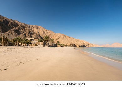MUSANDAM, OMAN - NOVEMBER 18, 2016: The beach at Zighy Bay in the Omani enclave of Musandam