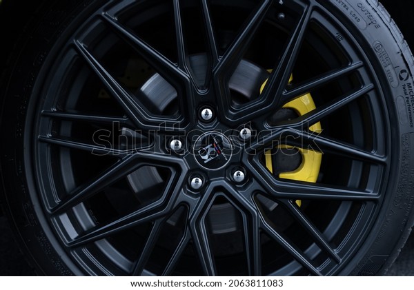 Muscle car Ford Mustang. Wheel\
close-up, yellow caliper. Russia, Rostov-on-Don 23 Oct2021\
