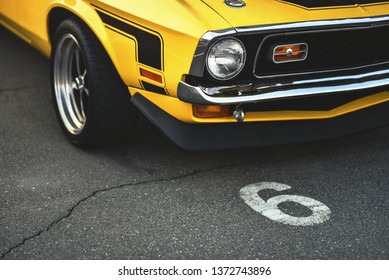 muscle car on parking lot - Powered by Shutterstock