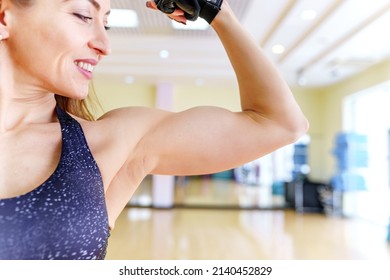 Muscle growth and fat burning. Sports girl in the gym. Fitness trainer before intense workouts. Active lifestyle of a woman.
