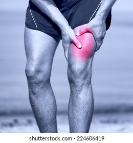 Muscle Sports Injury Of Male Runner Thigh. Running Muscle Strain Injury In Thigh. Closeup Of Runner Touching Leg In Muscle Pain.