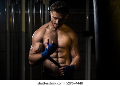 Muscled Boxer Wearing Blue Strap On Wrist