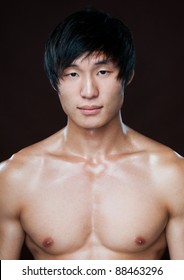 Muscled Korean model in whirte shirt