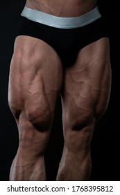 Muscled male legs on isolated background