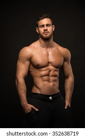 Muscled male model in studio - Shutterstock ID 352638719