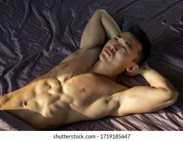 Muscled shirtless asian male model