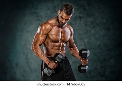 Muscular Athletic Men Exercise With Dumbbells