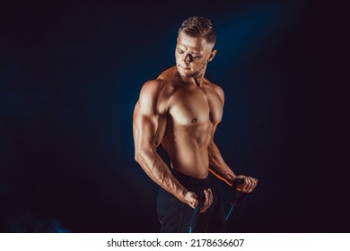 Muscular Athletic Men Exercise With Resistance Band. Copy Space.  - Shutterstock ID 2178636607
