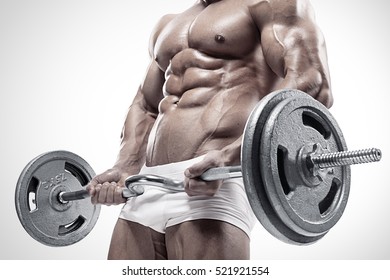 Muscular bodybuilder guy doing exercises with big dumbbell over white background