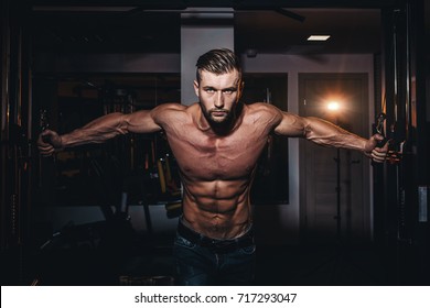 Muscular Bodybuilder Handsome Men Doing Exercises In Gym With Naked Torso. Strong Athletic Guy With Abdominal Muscles And Biceps