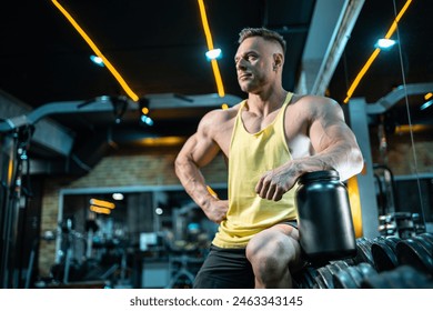 muscular bodybuilding athlete with perfect body holding protein or whey jar mockup in gym, athletic man in fitness club preparing sport nutrition and supplement - Powered by Shutterstock