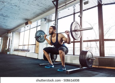 Muscular Fitness Man Doing Heavy Deadlift Exercise In The Gym