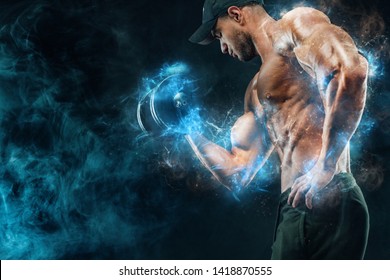 Muscular fitness sports man, atlete with dumbbell in fitness gym. Energy and power. - Powered by Shutterstock