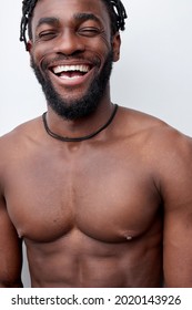 Muscular happy black shirtless guy enjoy spring free time weekend, smiling, having perfect toothy smile, posing isolated over white studio background. Handsome black guy with muscular naked torso