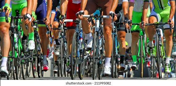 muscular legs of cyclists who ride during the international race