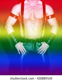 Muscular Male Torso Dressed In Fetish Black Leather With Rainbow Colors For Gay Pride