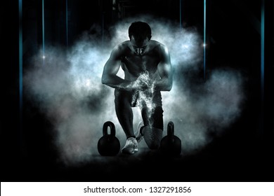 Muscular man clapping hands and preparing for workout at a gym. Focus on dust - Powered by Shutterstock
