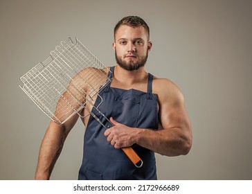 Muscular Man Cook In Chef Apron Hold Barbecue Grill, Picnic