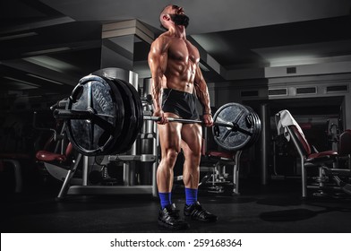 Muscular Man Doing Heavy Deadlift Exercise